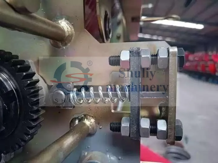 ressort supplémentaire et vis